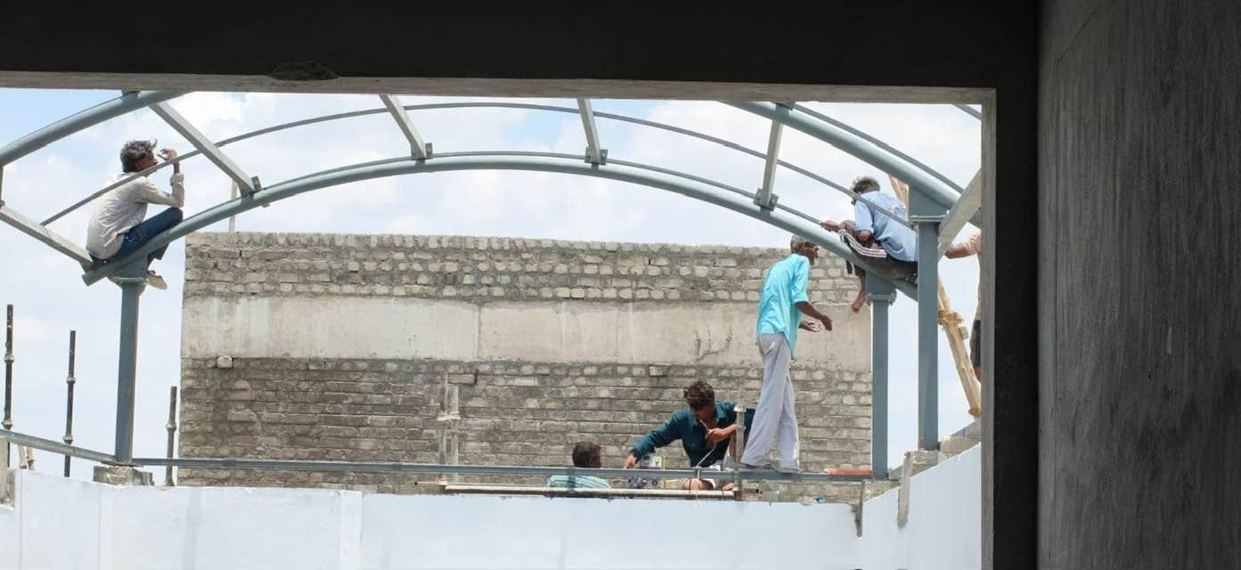Our team installing a curved steel roof frame