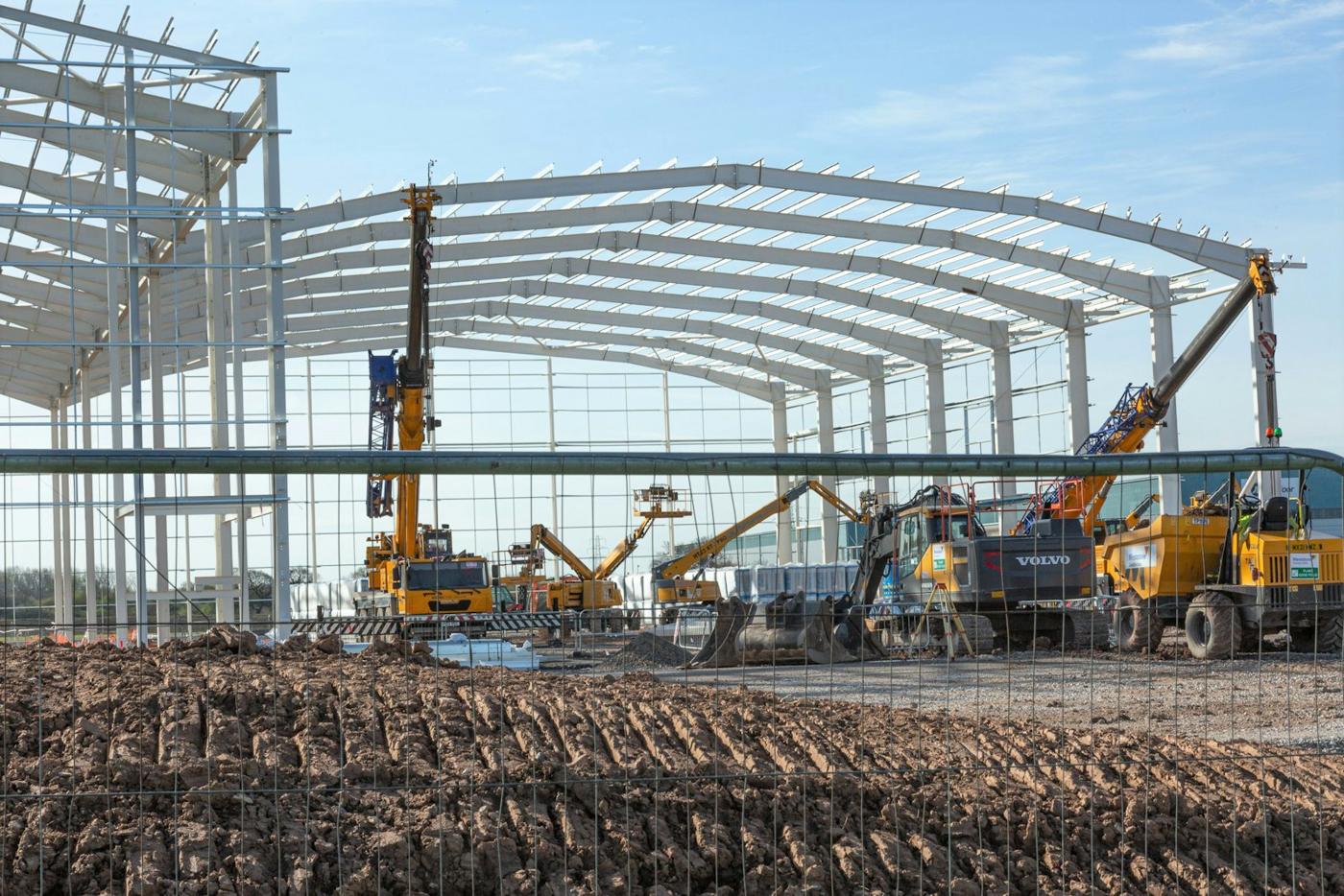 Pre-engineered steel building frames being erected